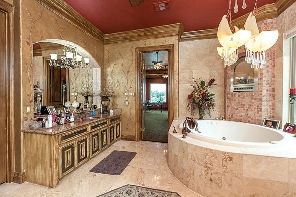 For sale in Texas, a stately Mediterranean luxury home with Louis Vuitton branded bedroom