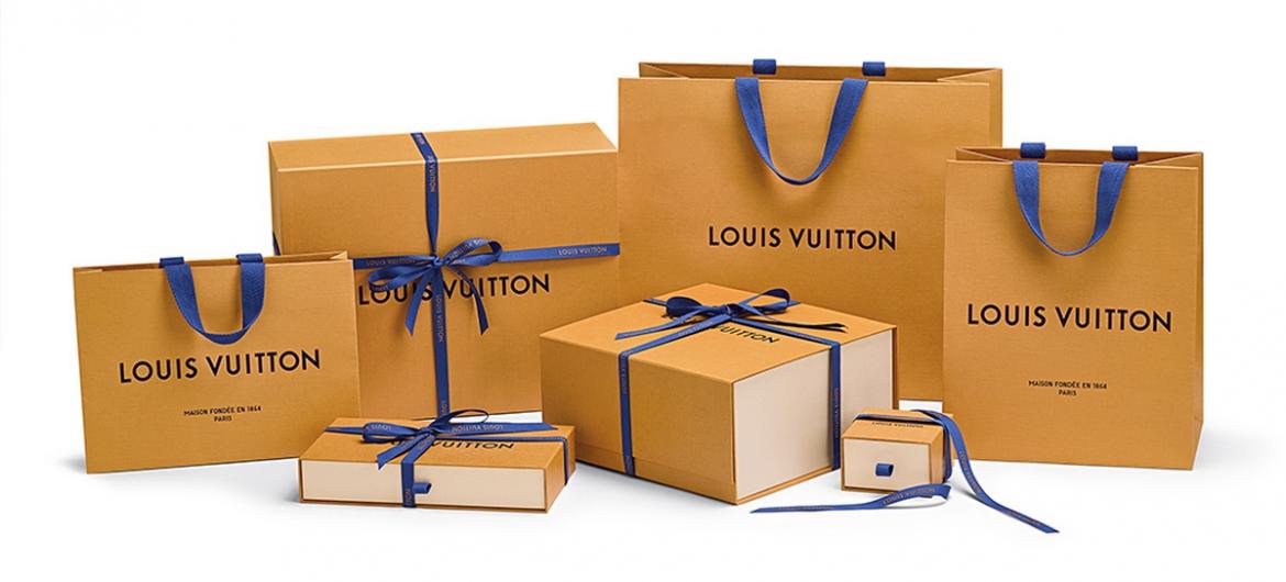 Louis Vuitton trades in their chocolate colored packaging for a new saffron hue