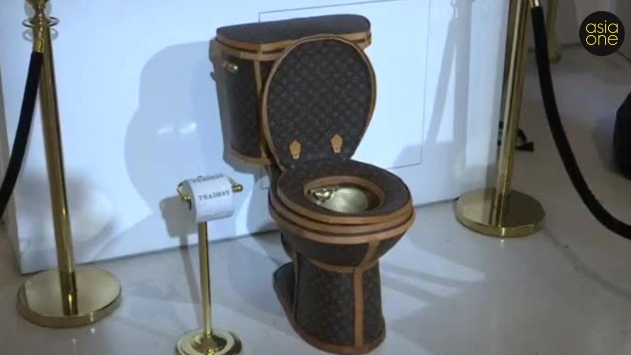 Yes, this is real - A golden toilet covered in Louis Vuitton bags that costs $100,000