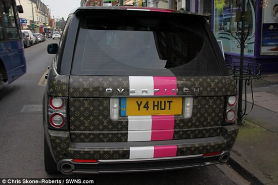 Range Rover in front of Louis Vuitton