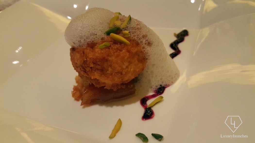 Fried malai kulfi -  gulab jamun crumble with vanilla foam and a line of grape passion fruit chutney