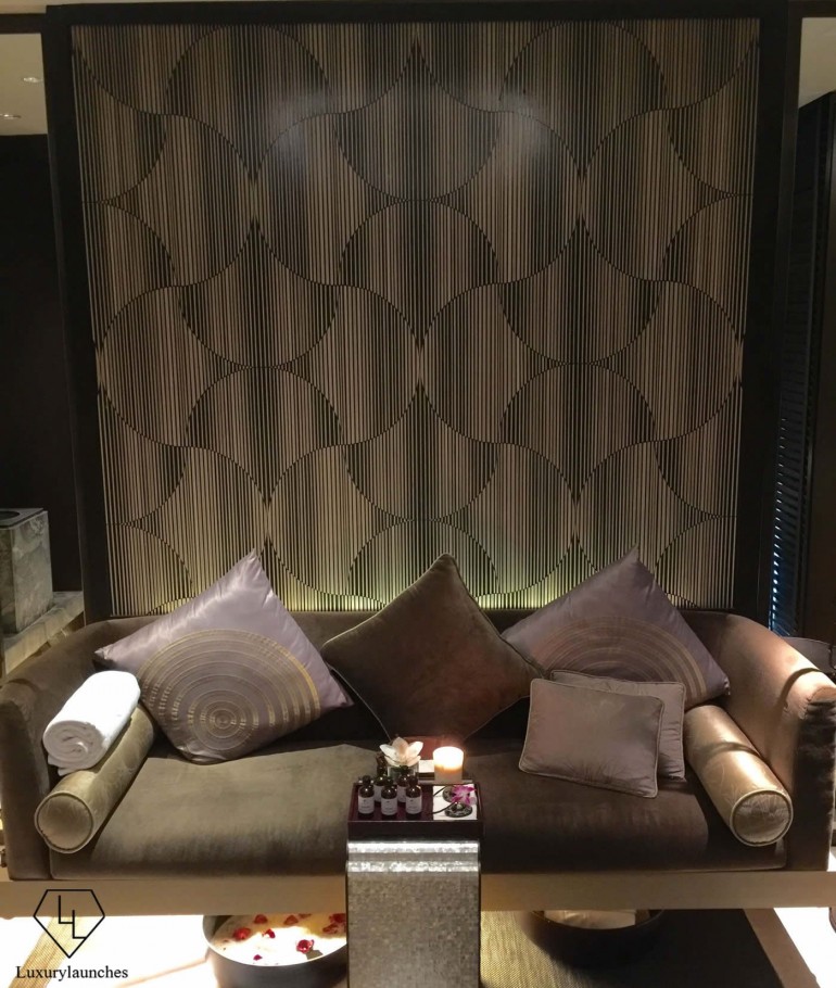 A hanging sofa in the couples’ suite furnished with rich, warm fabrics and purple accents made for a cosy, beautiful setting