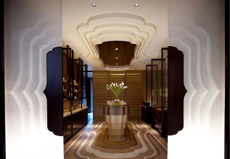 The entrance of the spa features a cloud silhouette motif that is seen throughout the spa in its décor and light fixtures