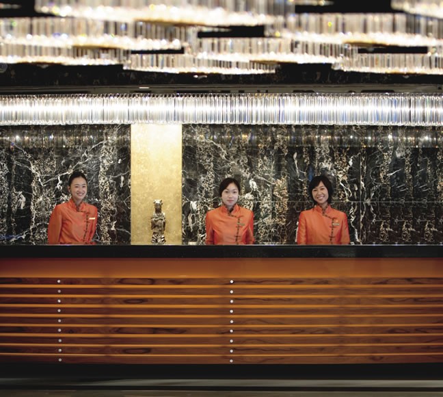 The reception area and orange qipao-wearing staff are just two iconic things in the hotel that haven’t changed in years
