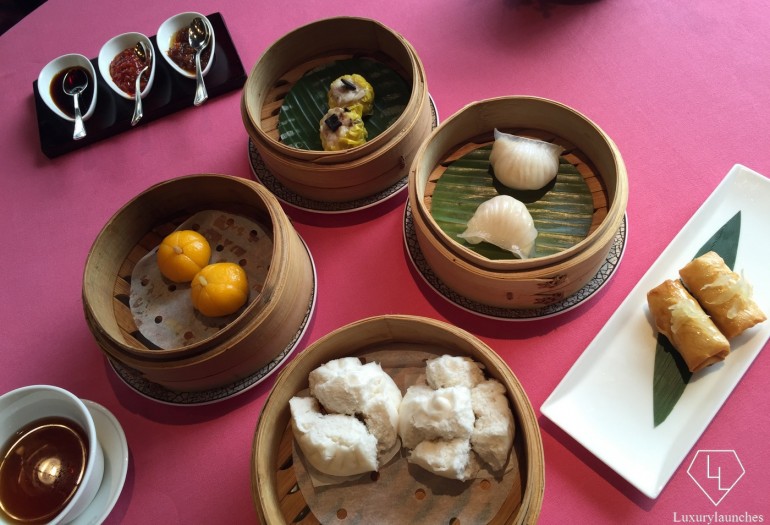  The first round (clockwise from extreme right) scallop and pomelo puff, barbecued Iberian pork bun, crabmeat and pumpkin dumpling, siu mai with black truffle, and tiger prawn and bamboo shoot dumpling