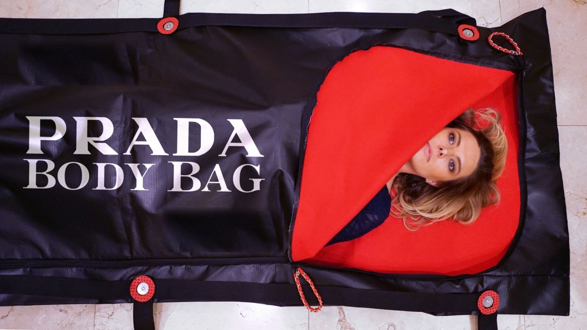 Saying farewell to the world in a Prada body bag ...