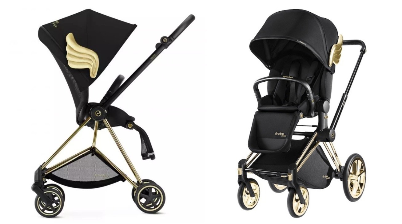 black stroller with gold wings