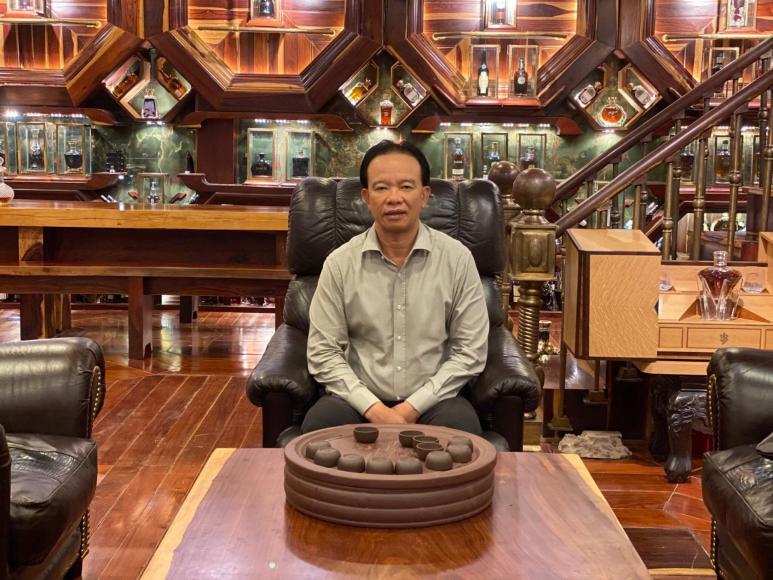 Mr Viet surrounded by his Guinness World Records whisky collection (1)