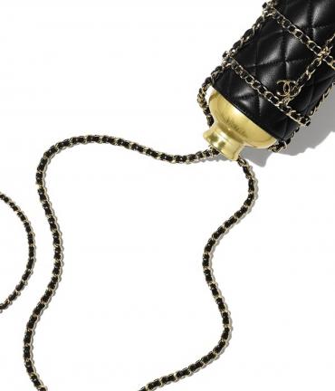 Care for a gold-colored Chanel water bottle with a flask bag for $5800 ...
