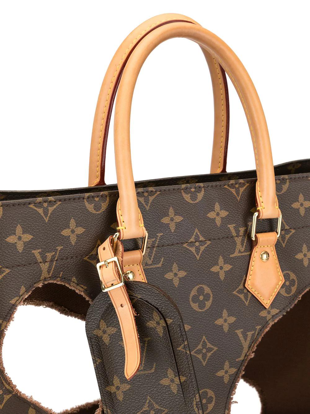 Style or senselessness? Would you buy this pre-owned Louis Vuitton handbag with giant holes in ...
