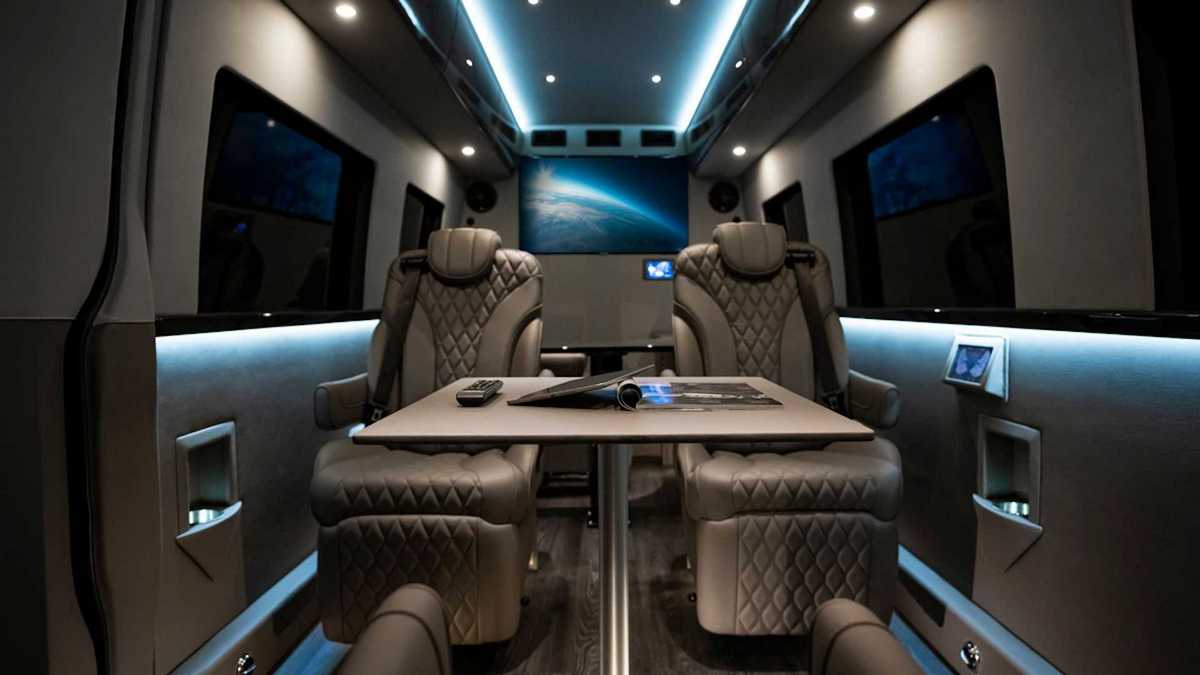 This ultra-luxurious Mercedes Sprinter van is armored and has an office  with a L shaped office desk - Luxurylaunches