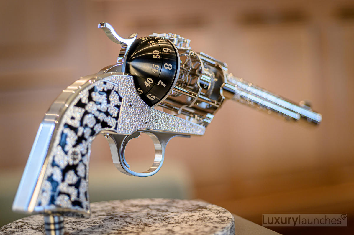 Hyper-exclusive horology: The one-of-a-kind revolver-styled table clock comes studded with 2,518 diamonds
