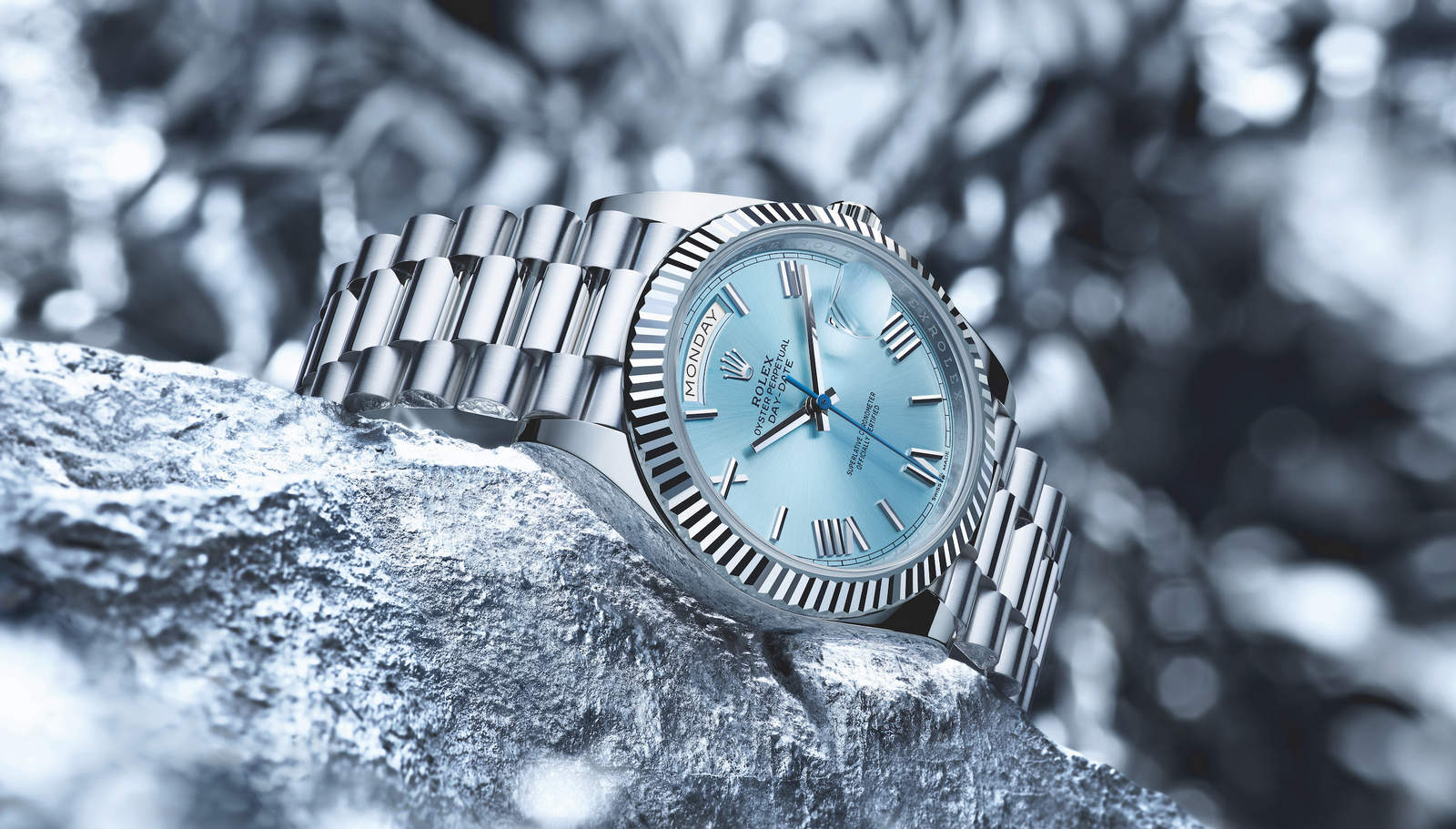 The flagship platinum Rolex Oyster Perpetual Day-Date 36 and 40 models have been updated with a fluted bezel